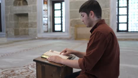 Man-quran-on-lectern