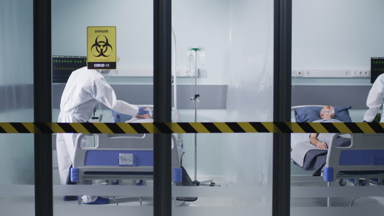 Medical staff caring for COVID-19 patients in hospital isolation ward