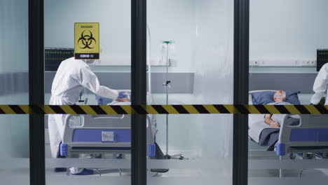 medical staff caring for covid-19 patients in hospital isolation ward