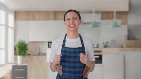 Happy-Indian-housewife-talking-to-someone