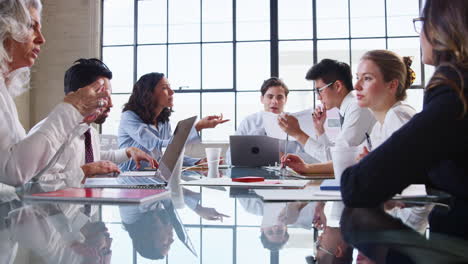 A-group-of-professionals-at-business-meeting-in-an-office