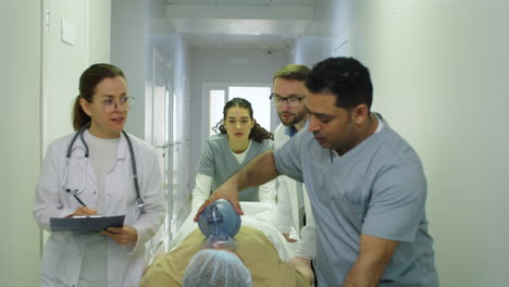 paramedics moving patient to emergency room