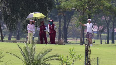 women golfers on a sunny golf course