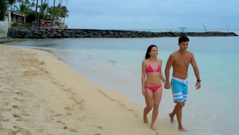 couple walking on the beach 4k