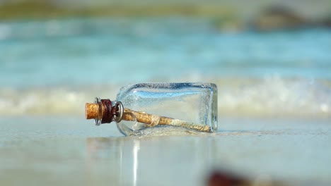 message in the bottle against the sun setting down