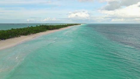 wide tulum beach in yucatan – aerial drone flyover of white sand shoreline