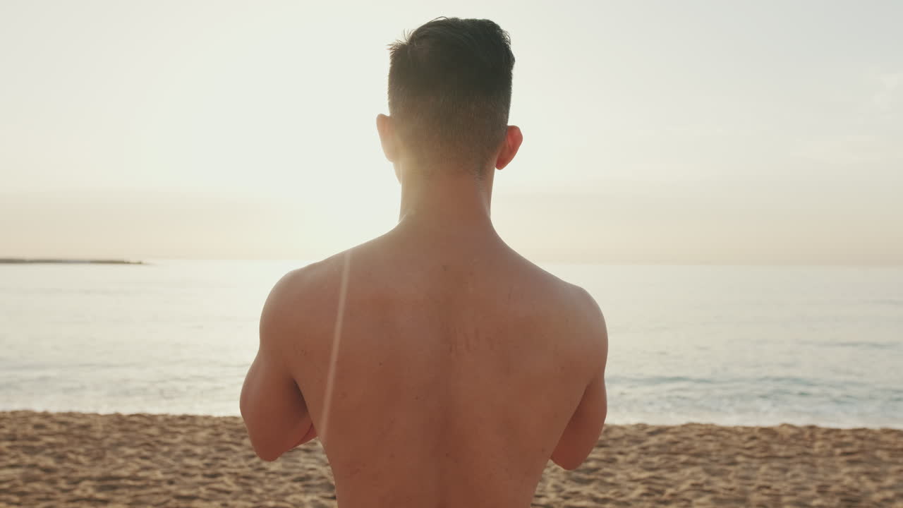 Man on a beach at sunrise