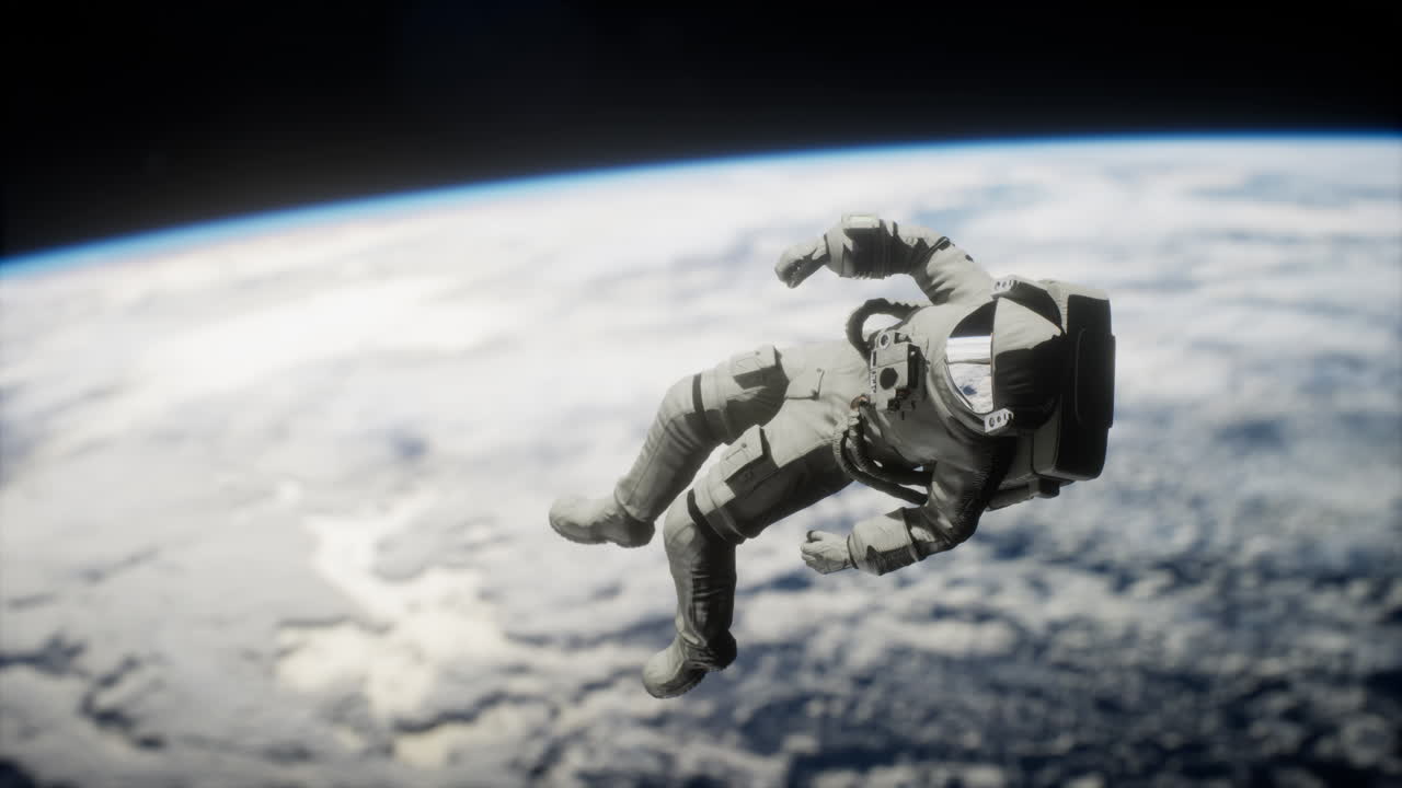 Astronaut floating above the Earth Elements of this image furnished by NASA