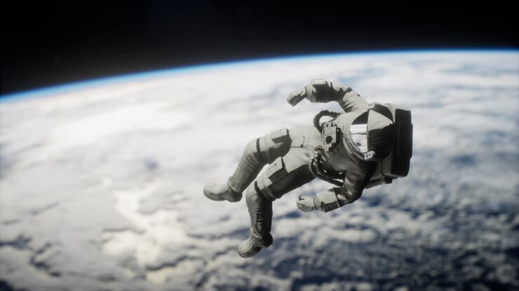 Astronaut floating above the Earth Elements of this image furnished by NASA
