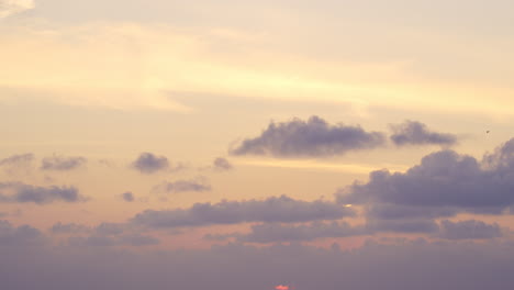 beautiful soft sunset colors reflected on the ocean with calm waters and a serene sky in estonia