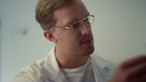 therapist examining x-ray patient lungs in clinic closeup. man doctor diagnosing