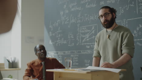 teacher delivering a lecture in a classroom