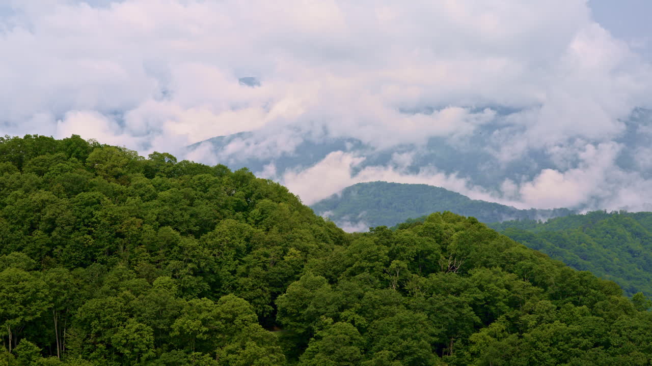 High-flying cinematic shot of mist in the Smokies.