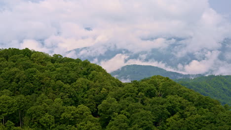 high-flying cinematic shot of mist in the smokies.