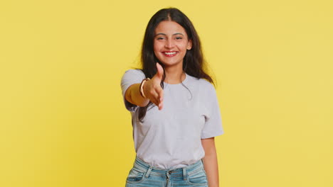 indian young woman outstretching hand to camera, offering handshake, greeting, invitation, welcoming