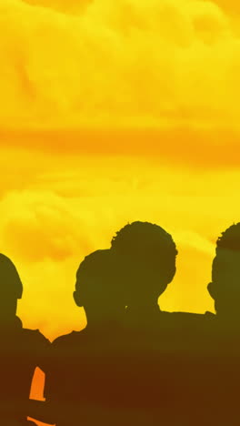 animation of people shadows on yellow clouds