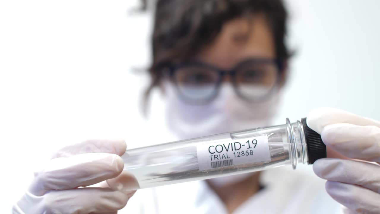 Medical Professional Holding COVID-19 Trial Test Tube