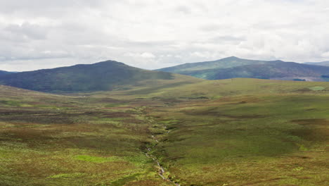 aerial shot of stream in wicklow mountains national park in county wicklow, ireland