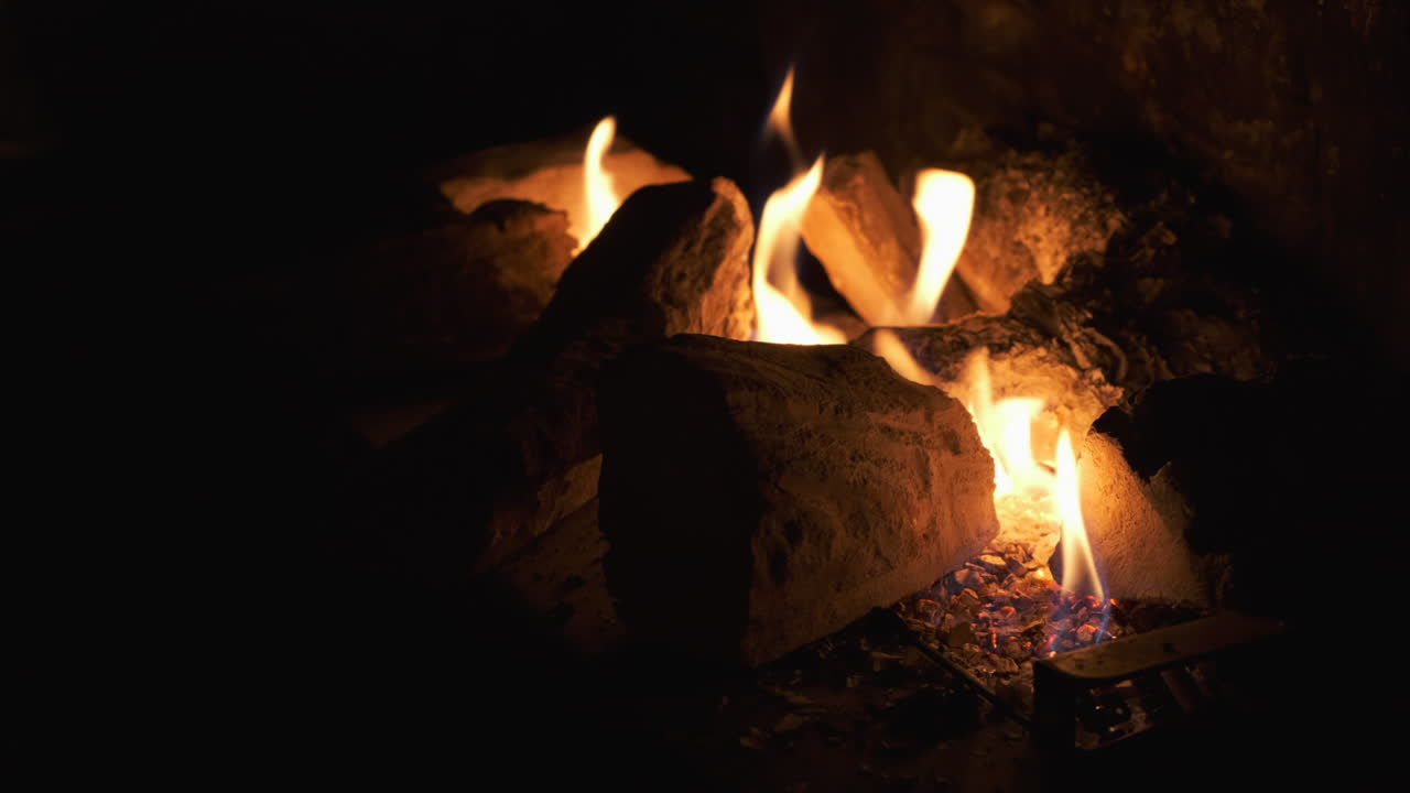Fireplace. Fire. In the dark.