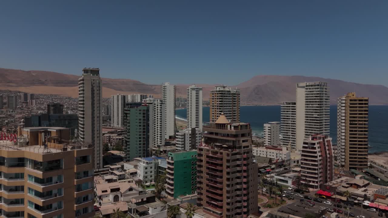 Iquique playa brava chile tarapaca cavancha day beach city buildings sea