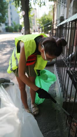 volunteer cleaning up a city street