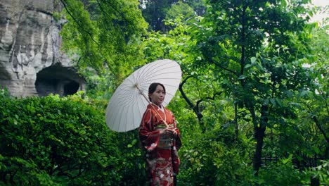 japanese woman in kimono in a garden