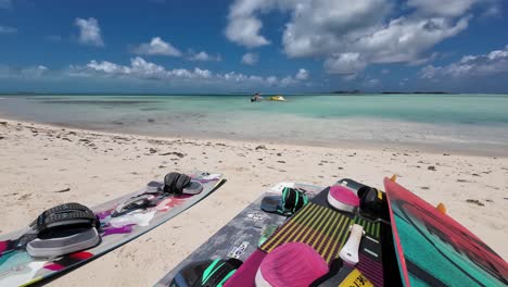 boards on white sand beach ready to fly, kitesurf and foil in los roques