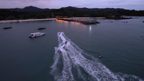 aerial: jets ski's in front of the lo chak beach on ko yao yai island in thailand