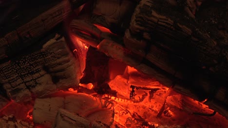 glowing logs in wood burner stove. uk