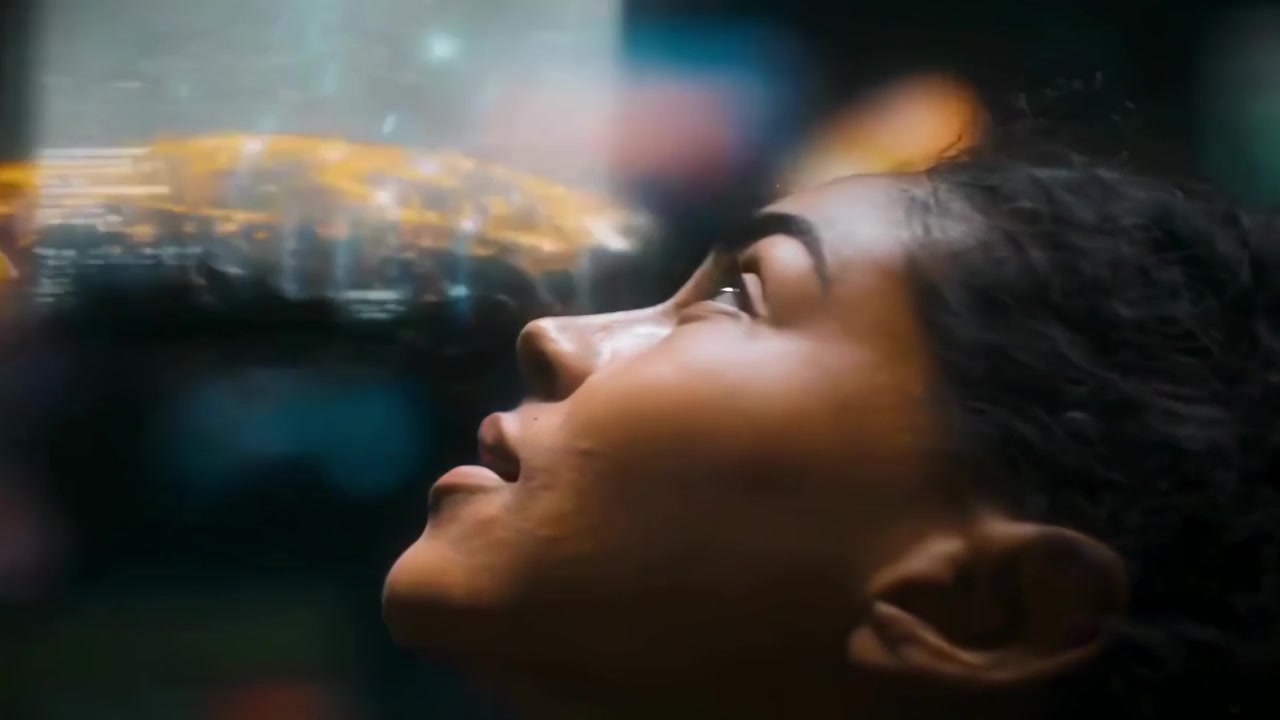 Young Woman Looking Up at Immersive Digital Displays