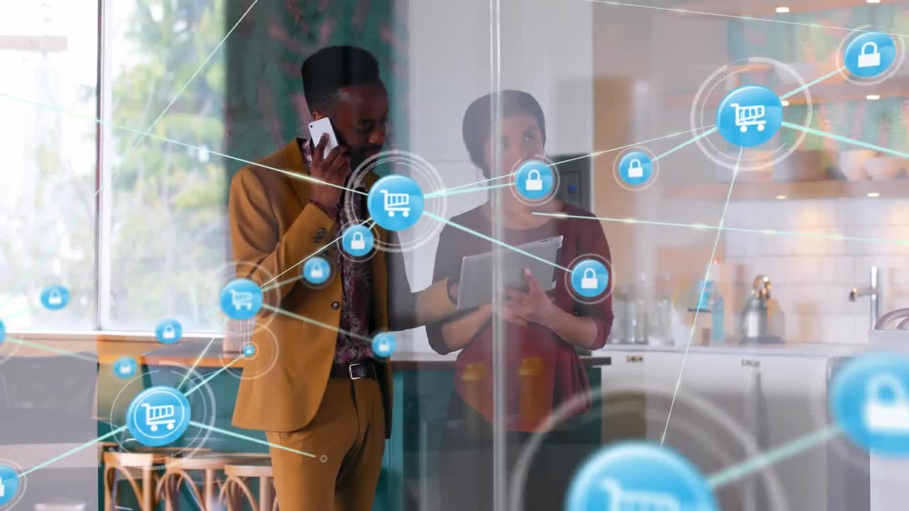 Network of digital icons on diverse businessman and businesswoman using electronic devices at office