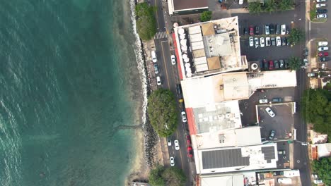 aerial of trafficked roads and houses by ocean in lahaina, hawaii