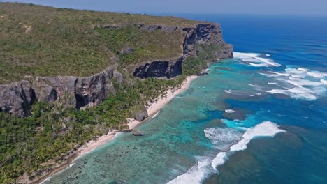 massive rock formation, half island, tropical caribbean, wave crash, aerial view