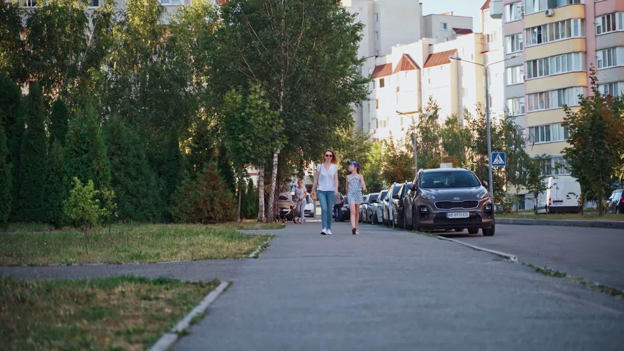 T rex walking at city. Person in t rex costume prankster walking at city street