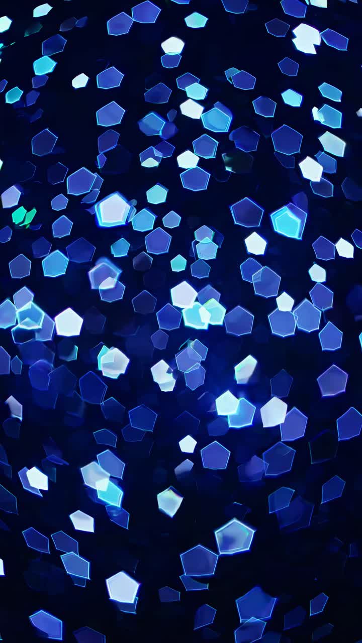 Abstract video background with glowing blue hexagonal bokeh lights