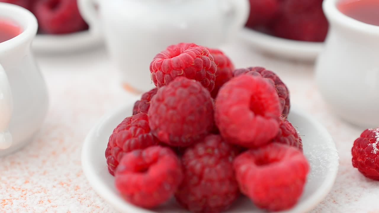 Raspberry and jam, still life. Shooting in the movement