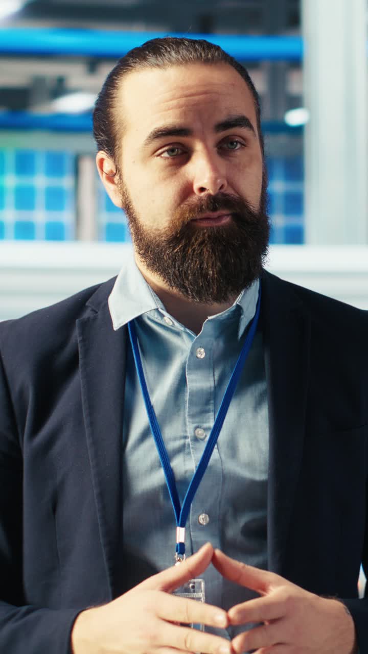 Vertical Video Man In Solar Panel Factory Filming Informational Video About Energy Production