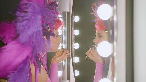 young pretty cabaret dancer making her up and getting ready for the show