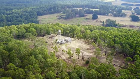 Aerial-footage-over-fire-tower-and-landscape-on-Blue-Mountain,-near-Newbury-in-central-Victoria,-Australia