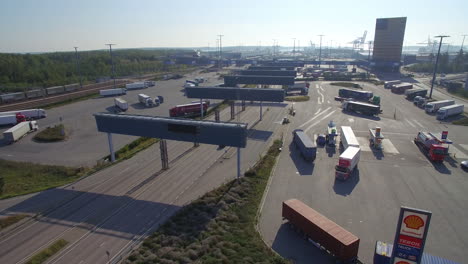 abc truckstop of vuosaari. the industrial area of vuosaari. droneshot of the highway 103 leading to abc stop and the truckstop.