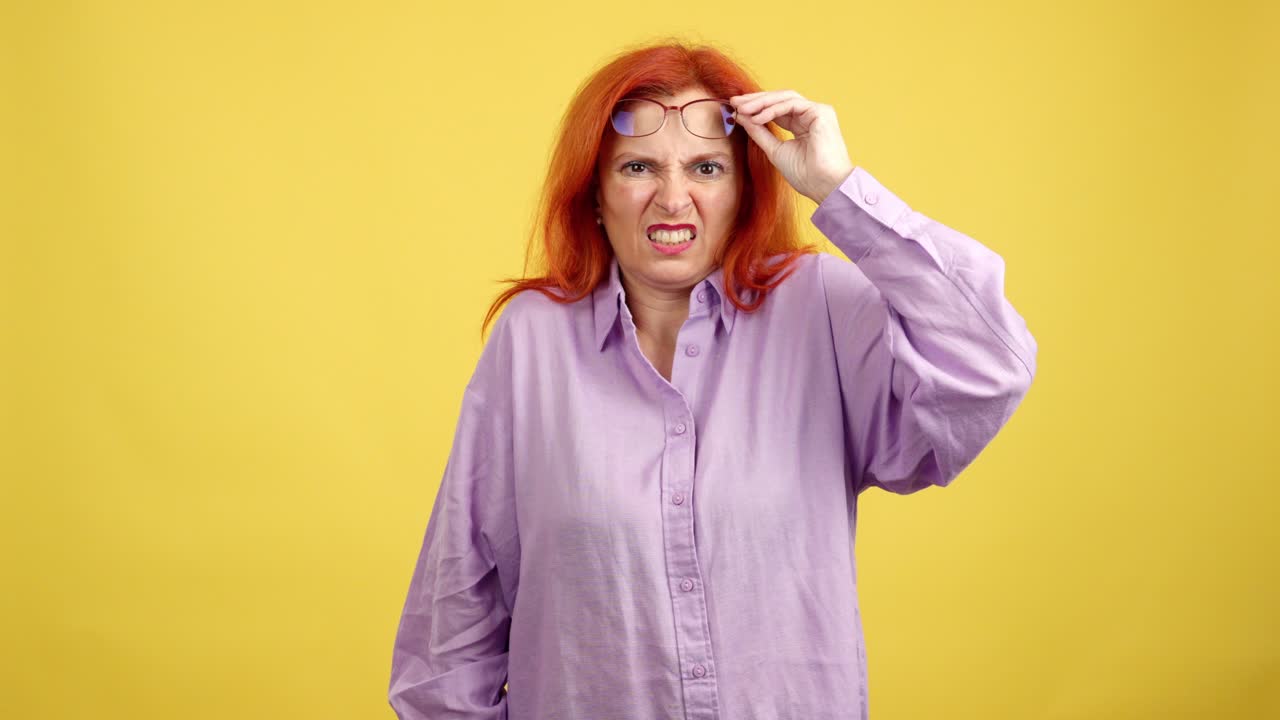 Red-haired Woman with Glasses Showing Confused and Disgusted Expressions