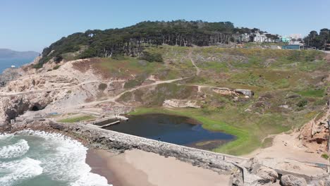 Wide-aerial-panning-shot-of-the-remains-of-the-Sutro-Baths-at-Land's-End-in-San-Francisco