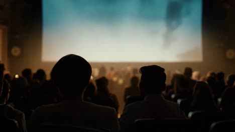 audience members enjoying a movie in a crowded theater, immersed in the cinematic experience on the big screen