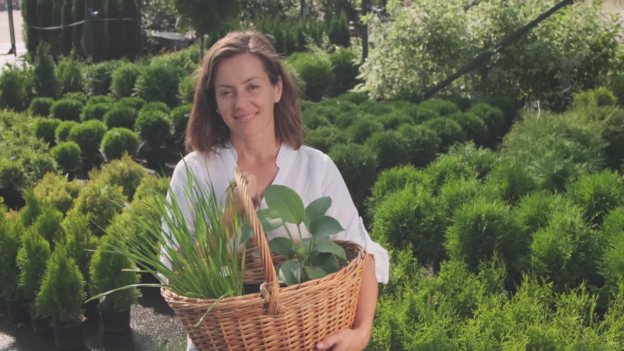 Woman with Plants in Garden Center