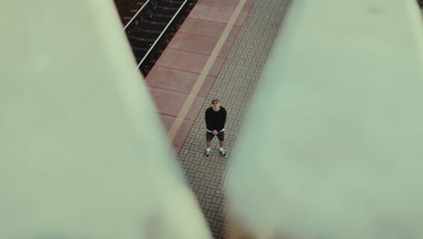 man walking at train station