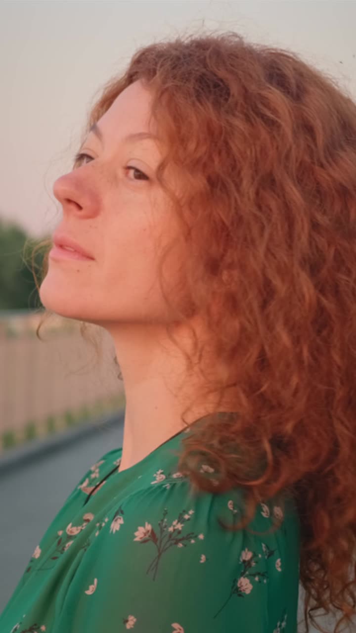 Woman with Red Curly Hair and Green Dress