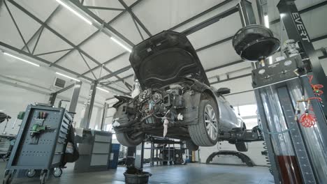 disassembled car engine in repair shop