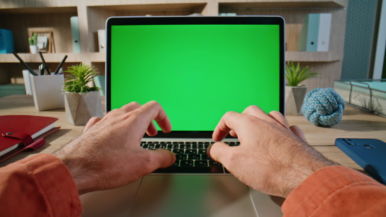 Hands surfing online green screen laptop at modern workplace closeup zoom in