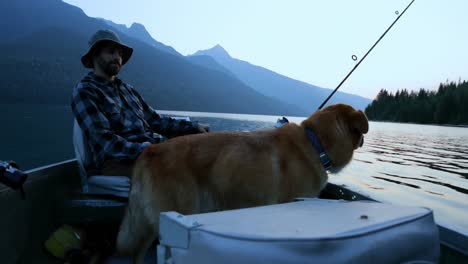 fishermen fishing with his dog in the river 4k