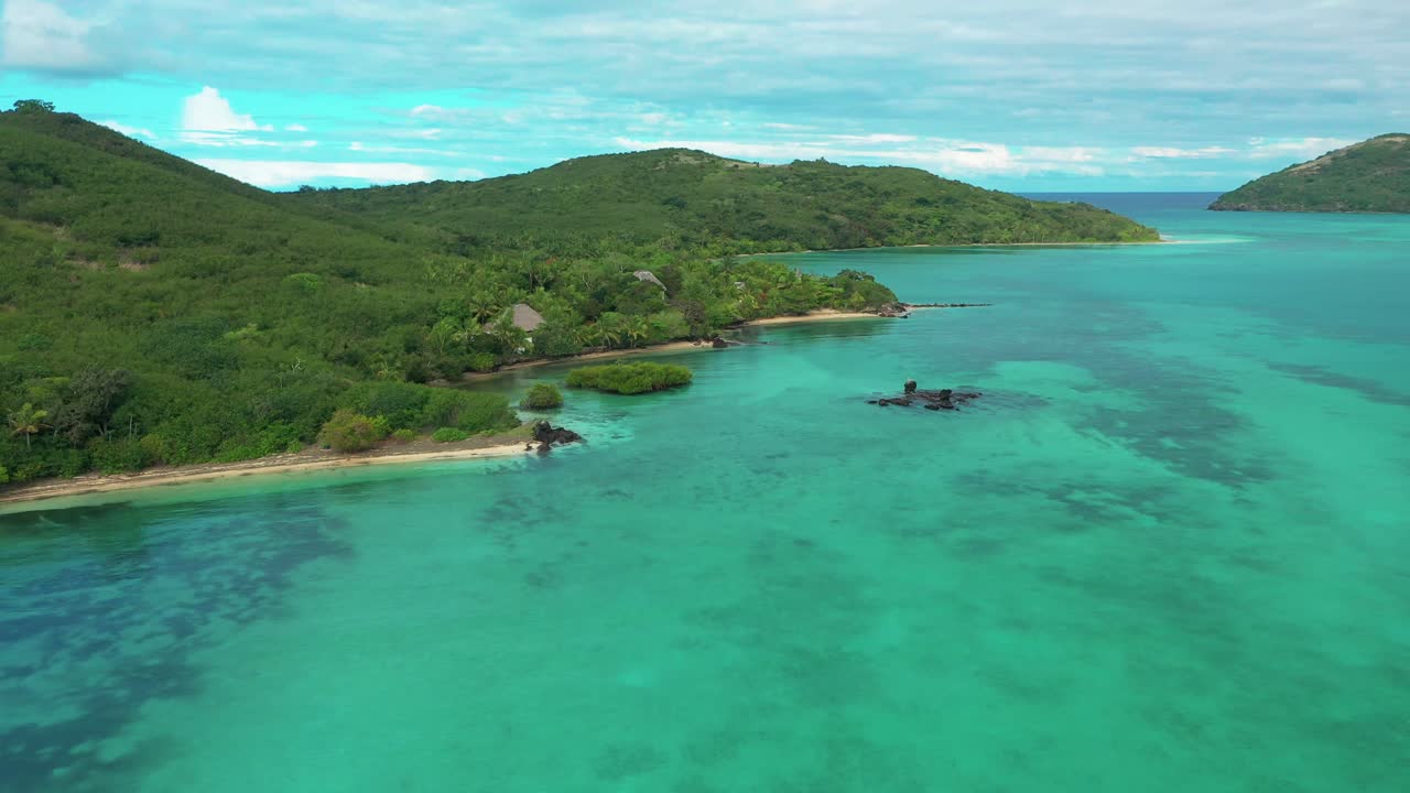 The beautiful green Fiji islands on a bright sunny day - aerial